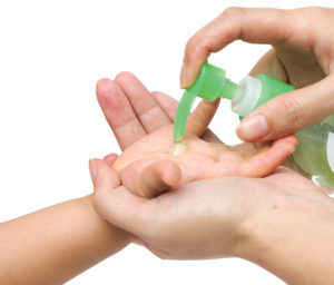 Squirting lotion on child's hand